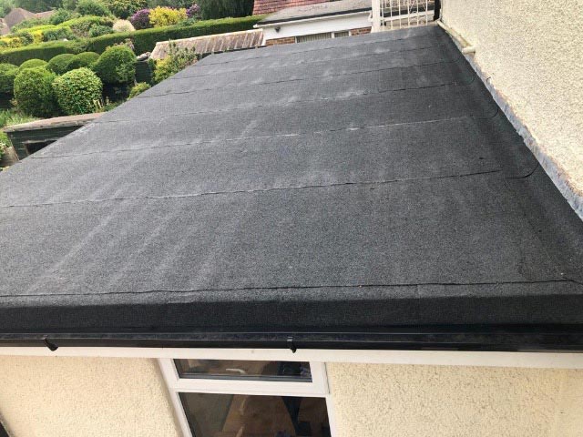New Polyester Torch-on Roof Felt Supplied and Fitted to a Properties Flat Roof in Ferndown Photo - Bournemouth Roofing Dorset Poole Christchurch